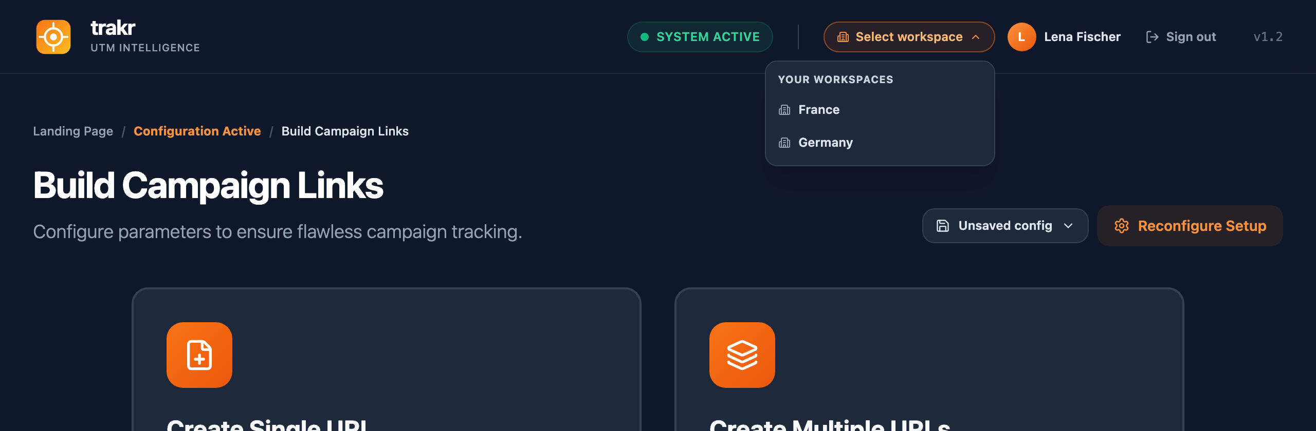 The workspace switcher dropdown in the Trakr header, open, listing the France and Germany workspaces